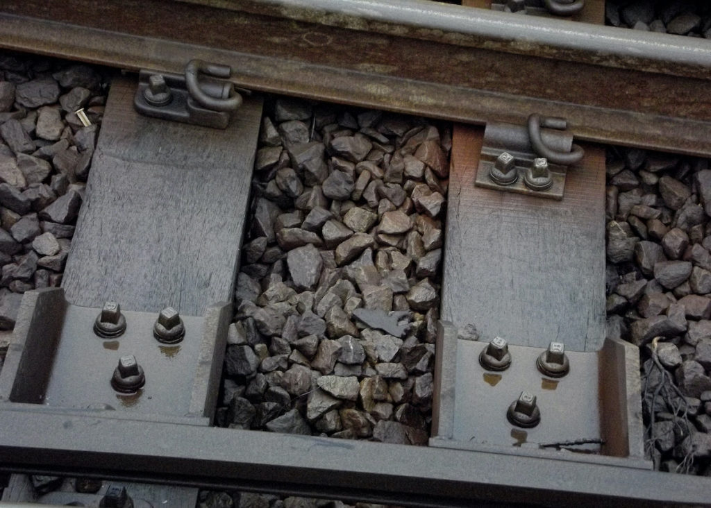 Why do railway tracks have crushed stones alongside them? - Alpha Rail